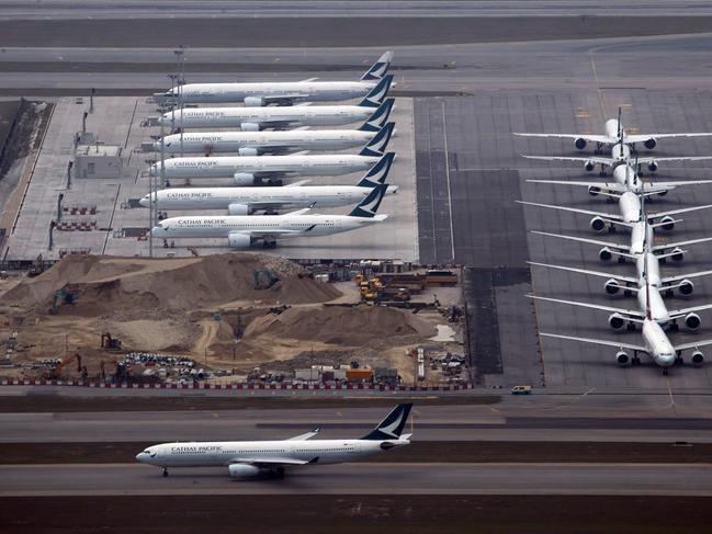 Cathay Pacific aircrafts line up on the tarmac at the Hong Kong International Airport, Friday, March 6, 2020. Picture: AP Photo/Kin Cheung