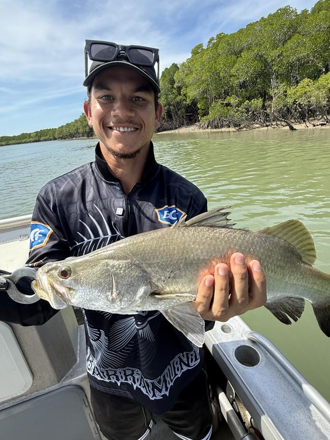 Gold Coast defender Daniel Rioli shows off his catch while fishing in Darwin the day after the Suns' win over the Western Bulldogs. Photo: Gold Coast Suns