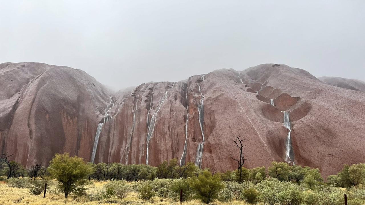 Rain smashing Central Australia produced a majestic display of waterfalls at Uluru. Picture: Facebook