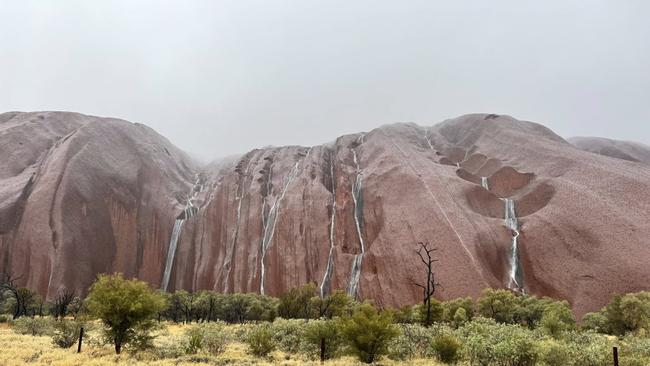 Rain smashing Central Australia produced a majestic display of waterfalls at Uluru. Picture: Facebook