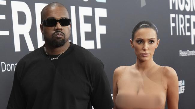 EDS NOTE: NUDITY - Kanye West, left, and Bianca Censori arrive at the 67th annual Grammy Awards on Sunday, Feb. 2, 2025, in Los Angeles. (Photo by Jordan Strauss/Invision/AP)