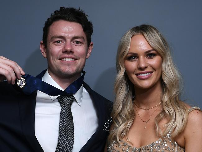 BRISBANE, AUSTRALIA - OCTOBER 18: Lachie Neale of the Lions poses with his wife Julie Neale after winning the Brownlow Medal at the Gabba during the 2020 AFL Brownlow Medal count on October 18, 2020 in Brisbane, Australia. (Photo by Quinn Rooney/Getty Images)