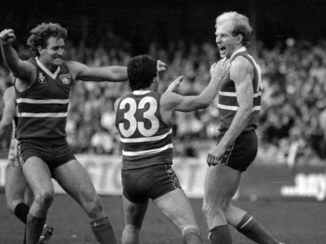 Allan Edwards and Brian Royal celebrate with Simon Beasley (right)