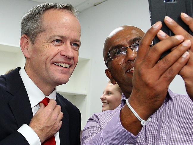 ADELAIDE, AUSTRALIA - JUNE 23: Leader of the Opposition, Bill Shorten takes photos with volunteers during a visit to the South Australian Labor Campaign Office on June 23, 2016 in Adelaide, Australia. Bill Shorten strongly reaffirmed Labor's commitment to the non privatisation of Medicare. Labor's Positive Plan for South Australia will include $500m for the AdeLINK tram project, funding for schools and hospitals and a $100 million for local steelmaker Arrium. (Photo by Lisa Maree Williams/Getty Images)