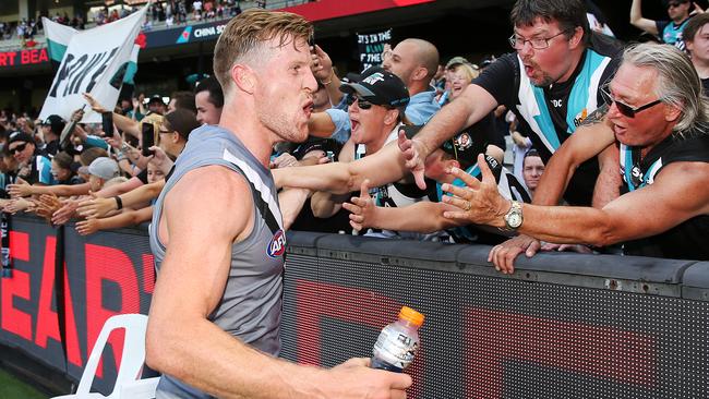 Tom Jonas celebrates with fans after Port’s win over Melbourne on Saturday. Picture: Michael Dodge (Getty).