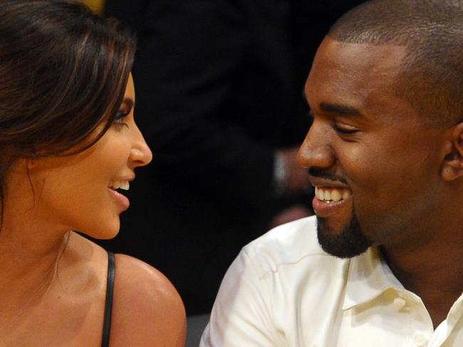 LOS ANGELES, CA - MAY 12: Kim Kardashian and Kanye West talk from their courtside seats before the Los Angeles Lakers take on the Denver Nuggets in Game Seven of the Western Conference Quarterfinals in the 2012 NBA Playoffs on May 12, 2012 at Staples Center in Los Angeles, California. (Photo by Noel Vasquez/Getty Images)