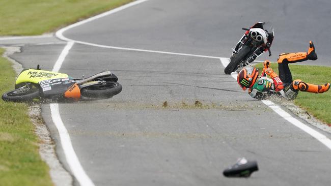 Andrea Migno crashes out of the Moto3 race.