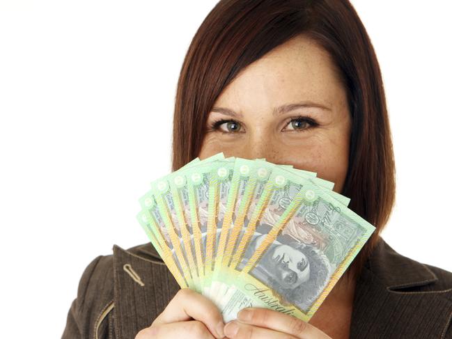 Woman with Australian currency. Picture: iStock To go with quesion: Should I discuss expected salary in my first interview?