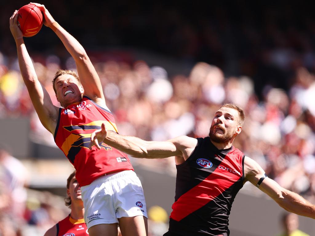 Jordan Dawson climbs above Ben McKay to mark.