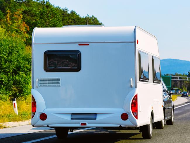 Vacation trip with Car with Caravan trailer on road of Slovenia. Auto and Camper carrier while Summer drive on highway. Holiday journey in rv motorhome on hauler. Motor home minivan motion ride  - Picture istock