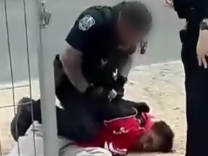 Watch: Police shove, drag man across driveway during arrest