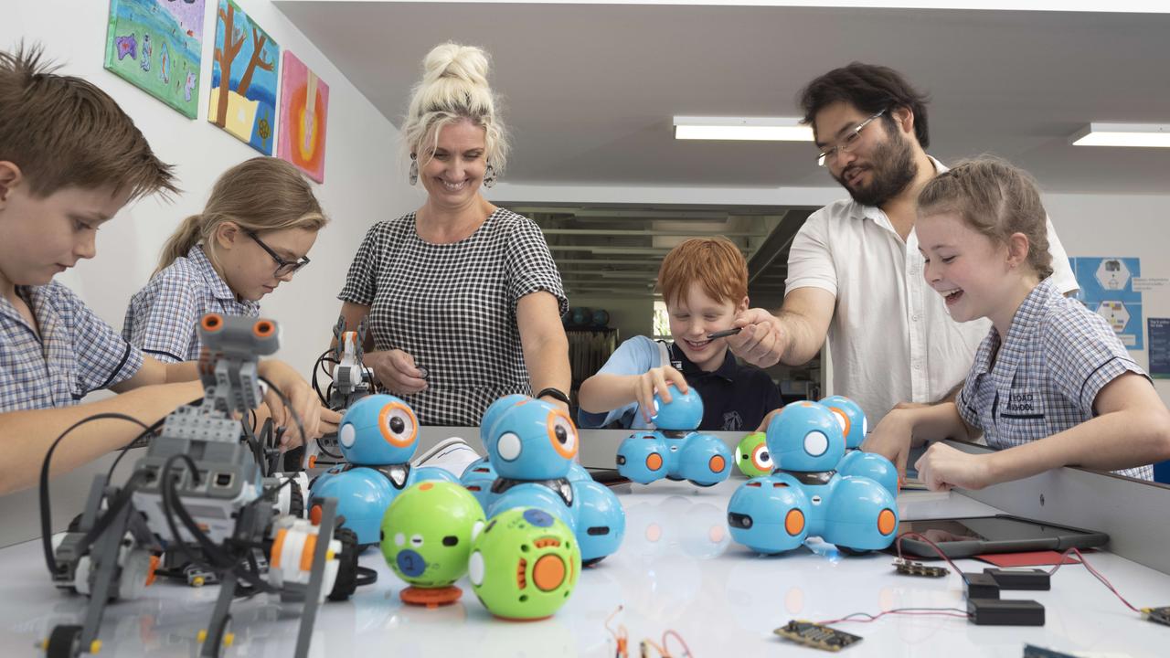 Students at Payne Rd State School working on a project for Curiocity with Engineer Educator Wilson Kong and Art and Technology Teacher Shannon Gibs. Picture: Russell Shakespeare