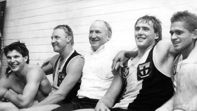 Frawley enjoys a win with ‘Joffa’ Cunningham, coach Darrel Baldock, Lockett and Nicky Winmar.