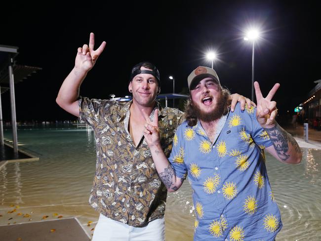 Mitch Pinchen and Luke Jefferis celebrate New Year's Eve on the Cairns Esplanade. Picture: Brendan Radke