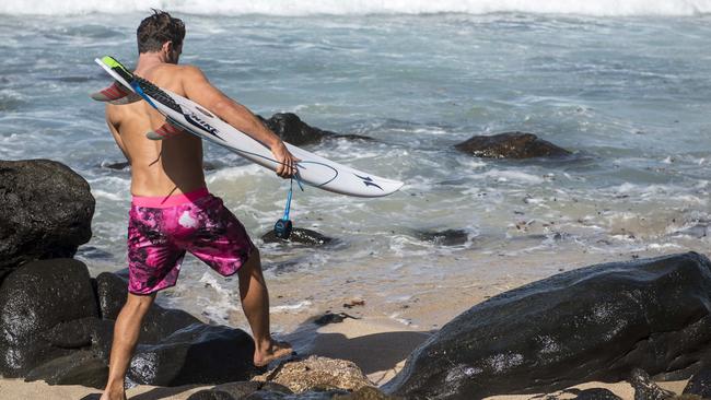 Julian Wilson wearing pink board shorts to raise awareness of breast cancer.