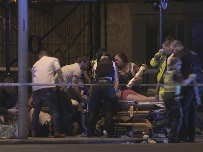 In this image made from PA Video footage, people receive medical attention in Thrale Street near London Bridge following the incident. Picture: Federica De Caria/PA via AP