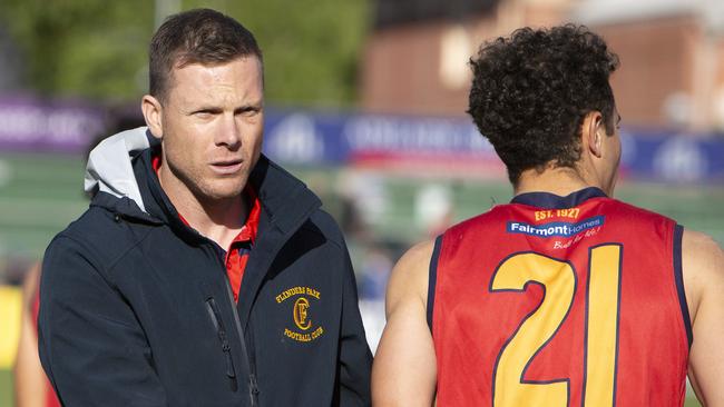 Flinders Park Coach Luke Ivens with player Anthony Laudato during the division three grand final against Golden Grove last season. Picture: Emma Brasier