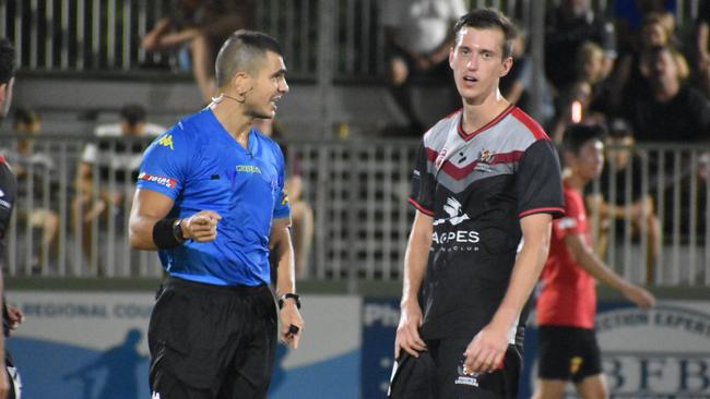 Daniel Simic is yellow carded in Magpies Crusaders v Sunshine Coast Fire in the FQPL1 at Sologinkin Oval. Saturday, March 19, 2022. Picture: Tara Miko