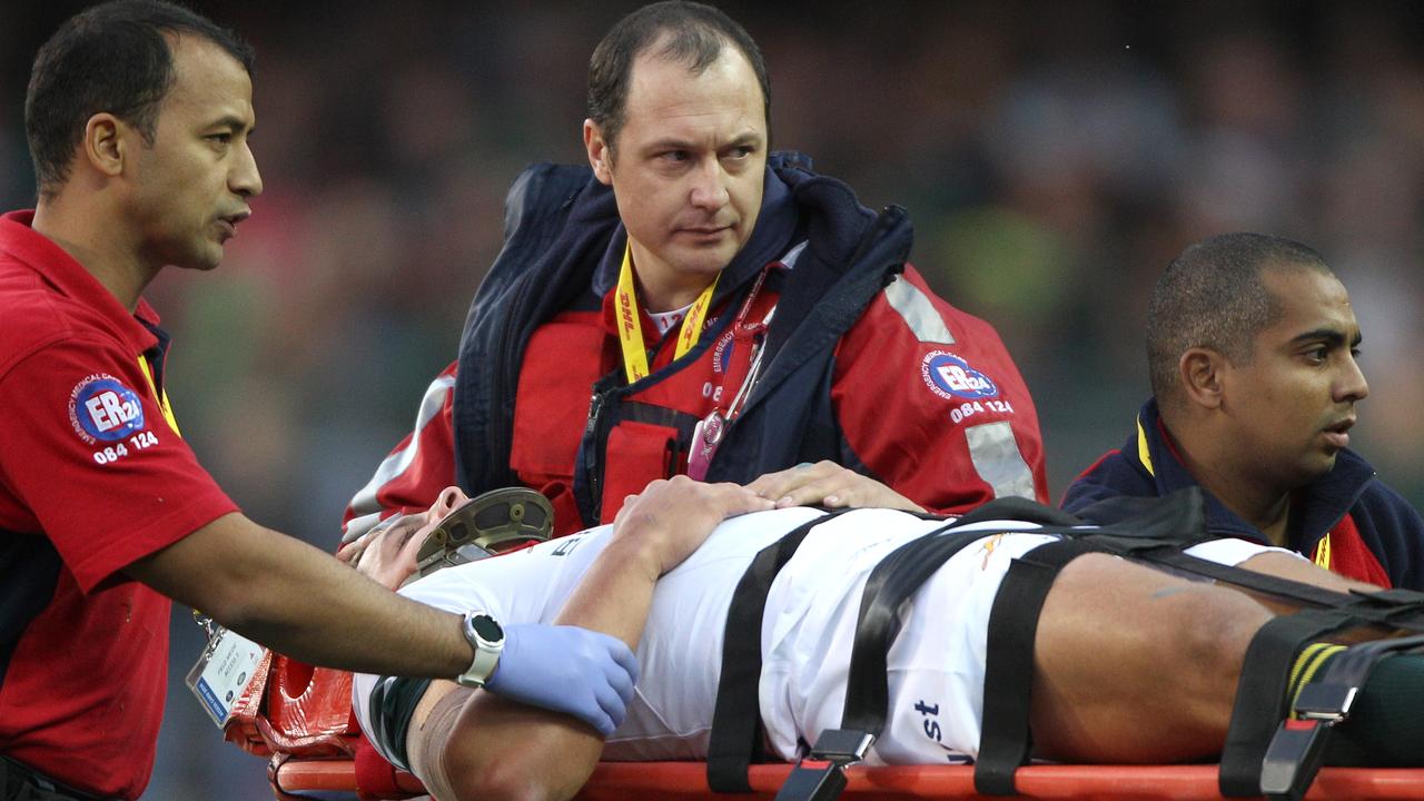 Pat Lambie of South Africa is stretchered from the field at Newlands.