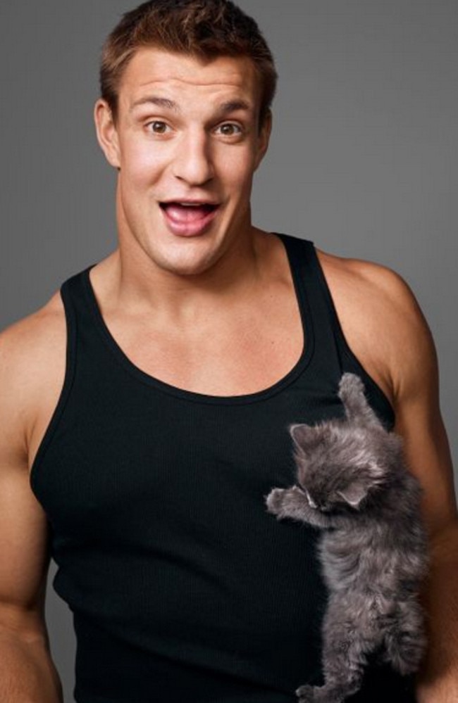 Gronkowski posing with a kitten in a shoot with ESPN.