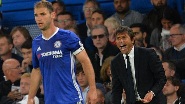 Chelsea's Italian head coach Antonio Conte (R) and Branislav Ivanovic.