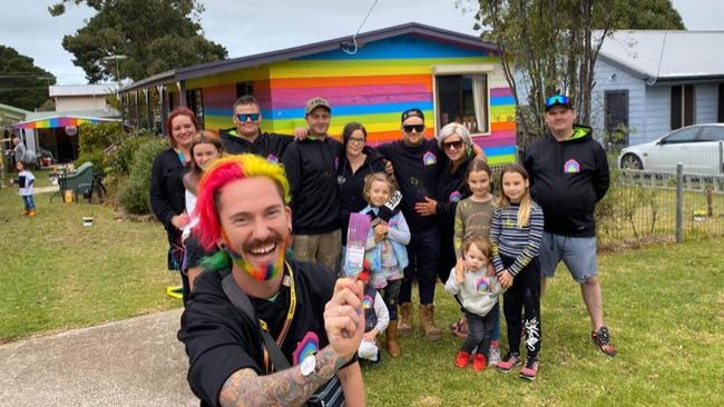 Volunteers travelled from Melbourne to help Mykey O'Halloran paint his Phillip Island house. Picture: Supplied