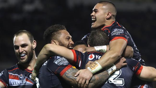The Warriors celebrate victory over the Broncos.