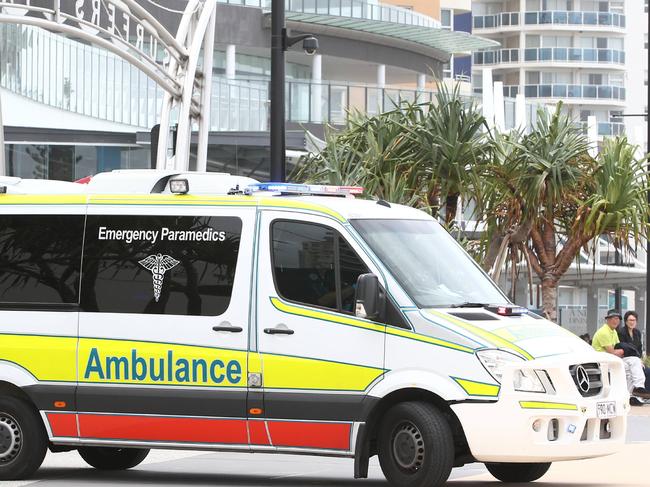 A woman had a cardiac arrest at Surfers Paradise beach and was taken away in an ambulance.