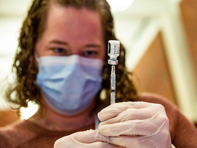 A medical worker prepares the Pfizer-BioNTech Covid-19 vaccine booster to be given to children 12-15 years old. Picture: AFP.