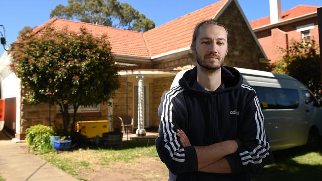 Aaron Danicek at his home on Anzac Highway. Mr Danicek has called on the government to compensate owners of nearby properties nearby by the new overpass. Picture: Naomi Jellicoe