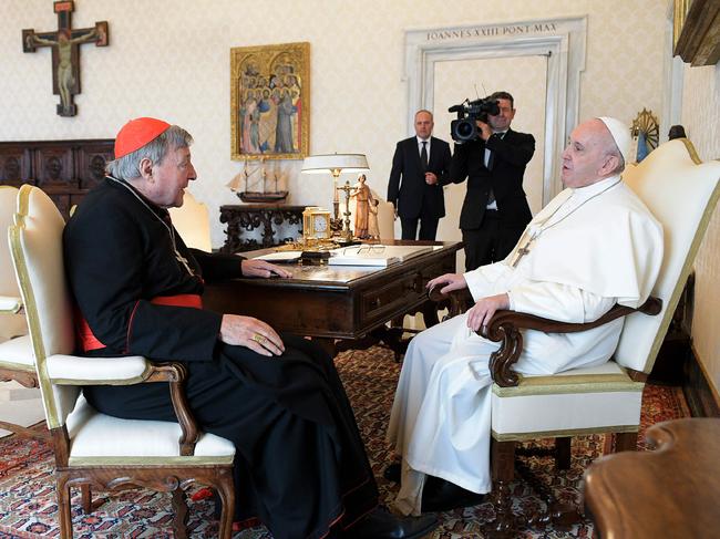 Pope Francis talking with Cardinal George Pell during a private audience at the Vatican. Picture: Vatican Media/ AFP