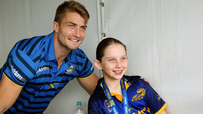 Kieran Foran with Sophie Skeen, 9, at the Blue and Gold Army Festival at Pirtek Stadium.