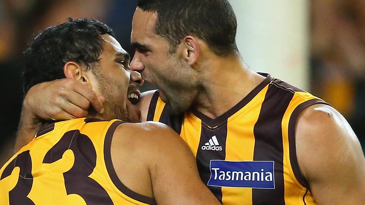 Shaun Burgoyne and Cyril Rioli celebrate a goal during the first preliminary final against Geelong in 2013. Picture: Getty Images