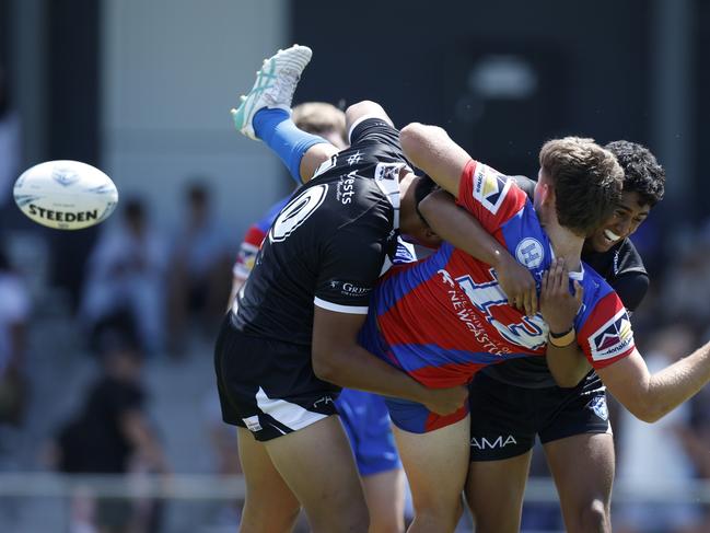 Fletcher O'Doherty is hit hard in defence. Picture: Michael Gorton