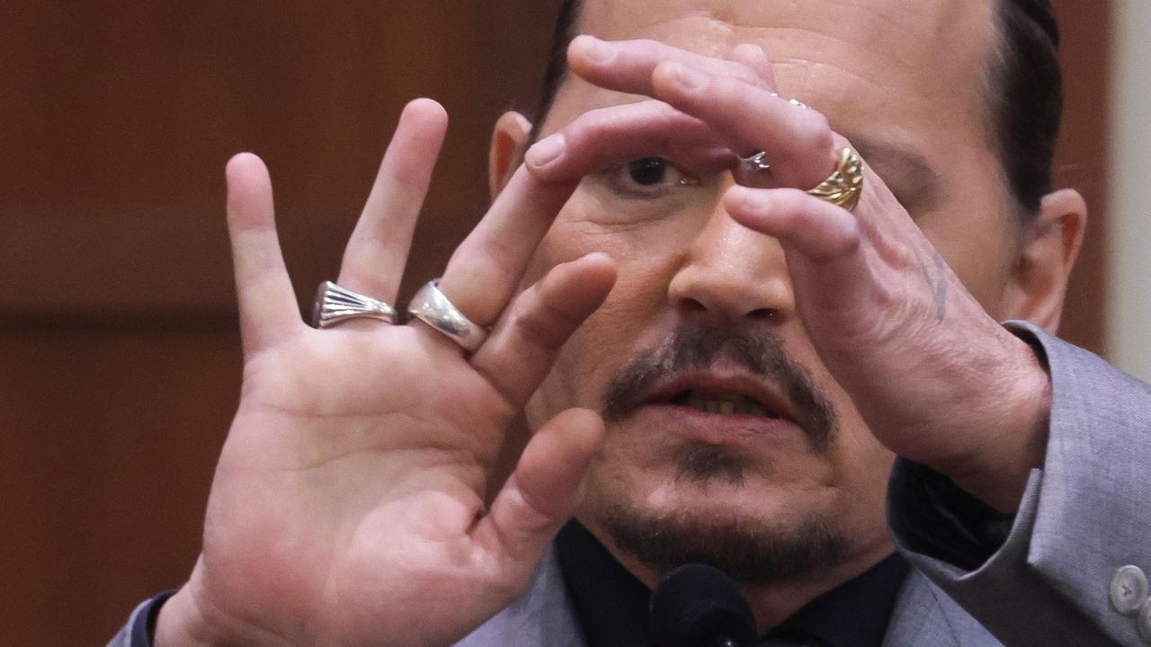 Mr Depp showed the middle finger of his hand during the trial. The actor allegedly injured his finger in a violent stoush with his ex-wife Amber Heard in Australia in 2015. Picture: Evelyn Hockstein/AFP