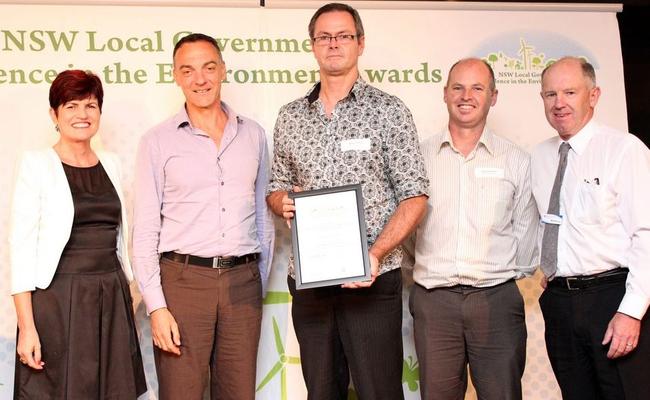 Minister for the Environment Robyn Parker presents the Local Government Excellence in the Environment Award to Lismore City Council's ecologist, Damian Licari; integrated strategic planner, Steve Denize; environmental strategies coordinator, Nick Stephens; and Bernie Bugden from Hawkesbury Nepean Catchment Management Authority.