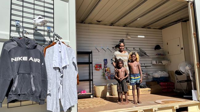 Elaine Duncan with her children at one of the remote op shops. Photo: Supplied