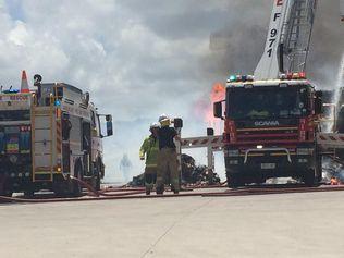 Firefighters continue to battle the blaze at Carters Transport at Coolum Beach.