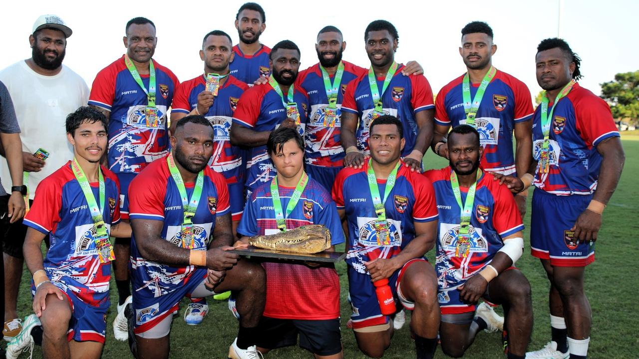 Croc champions Tabadamu Red posing with their winners trophy after their 19-14 grand final victory. Picture: From The Sidelines Photography.