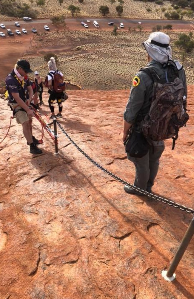 Uluṟu-Kata Tjuṯa National Park Park rangers on the rock in May 2019 after a man had a heart attack while climbing. Picture: Facebook
