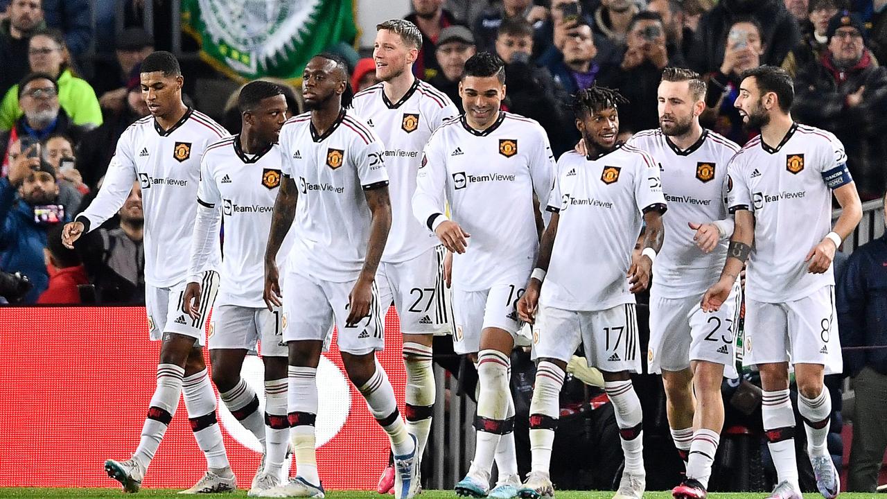 Manchester United's players celebrate after scoring a goal during the UEFA Europa League round of 32 first-leg football match between FC Barcelona and Manchester United at the Camp Nou stadium in Barcelona, on February 16, 2023. (Photo by Pau BARRENA / AFP)