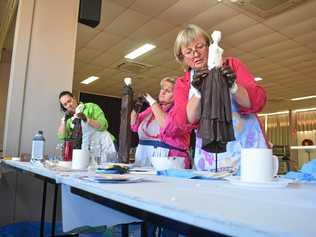 Fiona Moore, Larissa Jackson and Roslyn Ware working on garden sculptures at Injune's Creative Odyssey. Picture: Jorja McDonnell