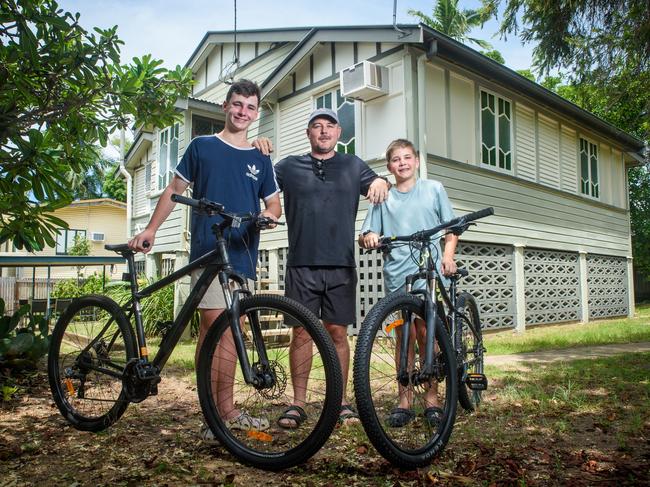 Joel Shields with his two boys Noah 14yo and Henry 11yo and dog Hugo at their home in North Ward, Townsville. Townsville tipped to be a buyers market this year. Picture: Scott Radford-Chisholm / The Australian