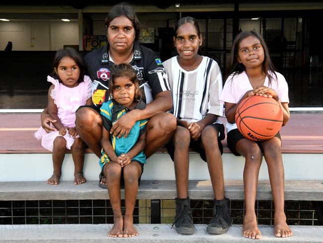 Christine Webb sits with her niece and daughters, who are soon to be affected by the de-funding of Community Gro's Youth Hub in Garbutt. Picture: Evan Morgan