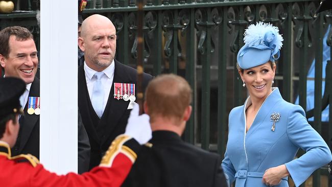 Princess Anne’s children, Peter Phillips and Zara Tindall with Mike Tindall (centre).Picture: AFP