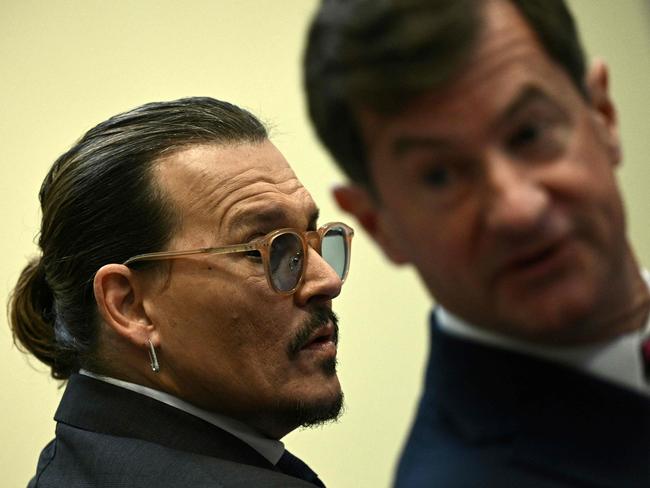 US actor Johnny Depp and his lawyer Ben Chew arrive in the courtroom gallery at the Fairfax County Circuit Courthouse in Fairfax, Virginia, May 17, 2022. Picture: Brendan Smialowski / AFP.