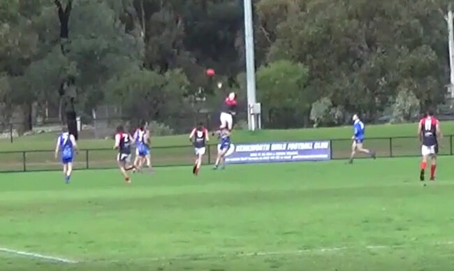 Lockleys footballer Charlie Rogers flies high for a big mark against Kenilworth.