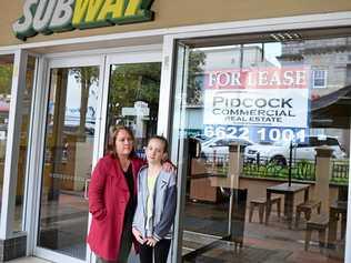 DEVASTATED: Kellie Acton said she and husband Andrew were "gutted" to have to close their Subway Restaurant on Molesworth St, in Lismore. She is pictured with daughter Mardhi. Picture: Francis Witsenhuysen