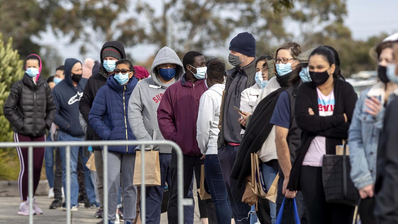 People queue for Covid vaccination at Sandown Racecourse on Saturday. Picture: NCA NewsWire / David Geraghty