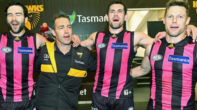 Jordan Lewis, Alastair Clarkson, Luke Hodge and Sam Mitchell sing the club song together. Picture: Getty Images